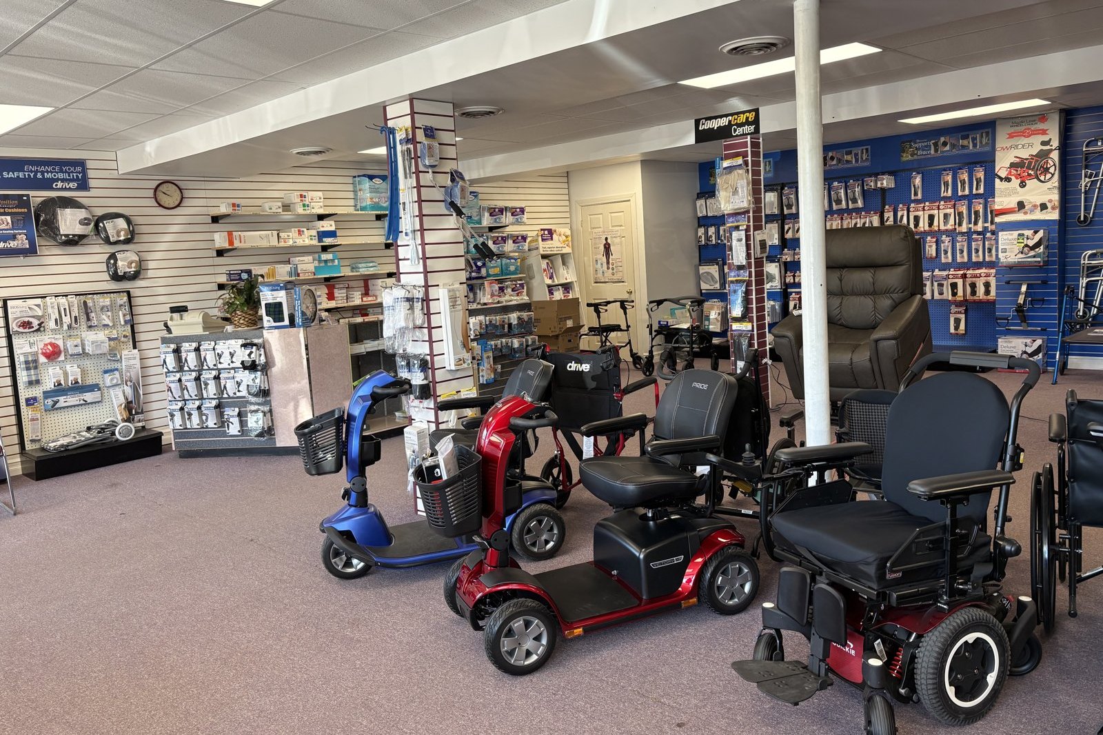 Inside the Home Health & Medical Supplies showroom in Renfrew, showing mobility scooters and power wheelchairs